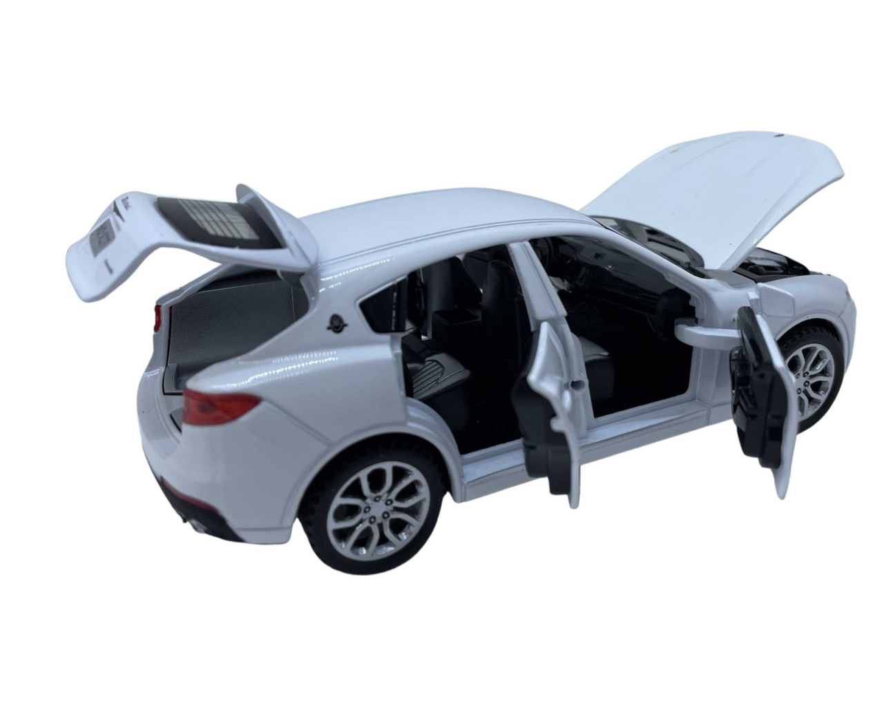 Macheta-Maserati-Levante-replica-deschide-usi-capota-portbagaj-17cm-alb_13891__74449.1711138063.1280.1280.jpg 803aec9871d2e9b18f1b5c9496bd38ef