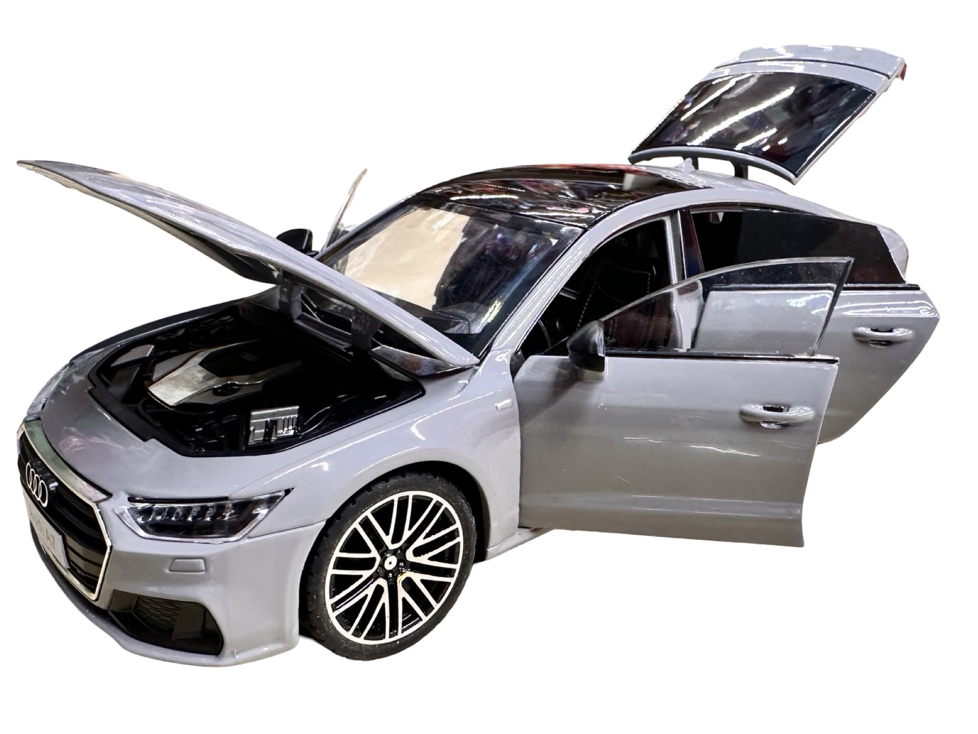 pixelcut_13-7 Macheta Audi RS7 gri 1:24 cu sunete lumini deschide toate usile si capotele - imagine 1